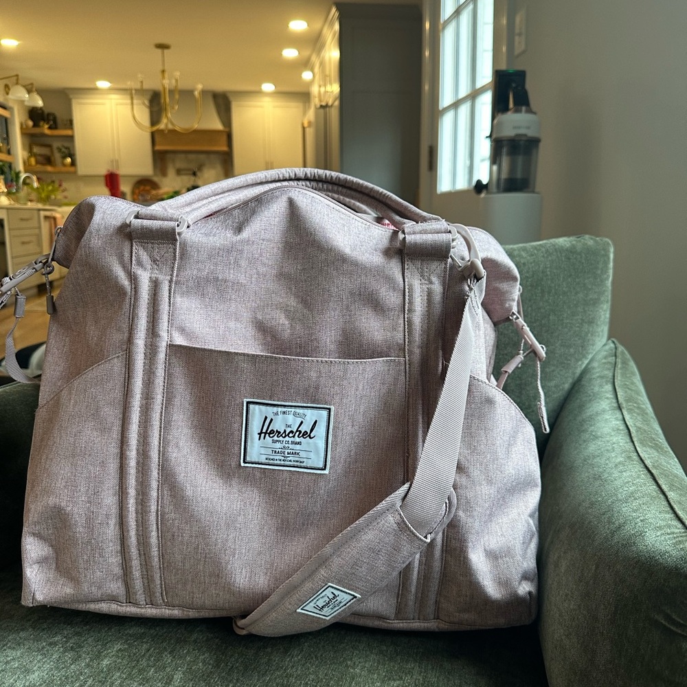 Herschel diaper bag in a dusty pink color